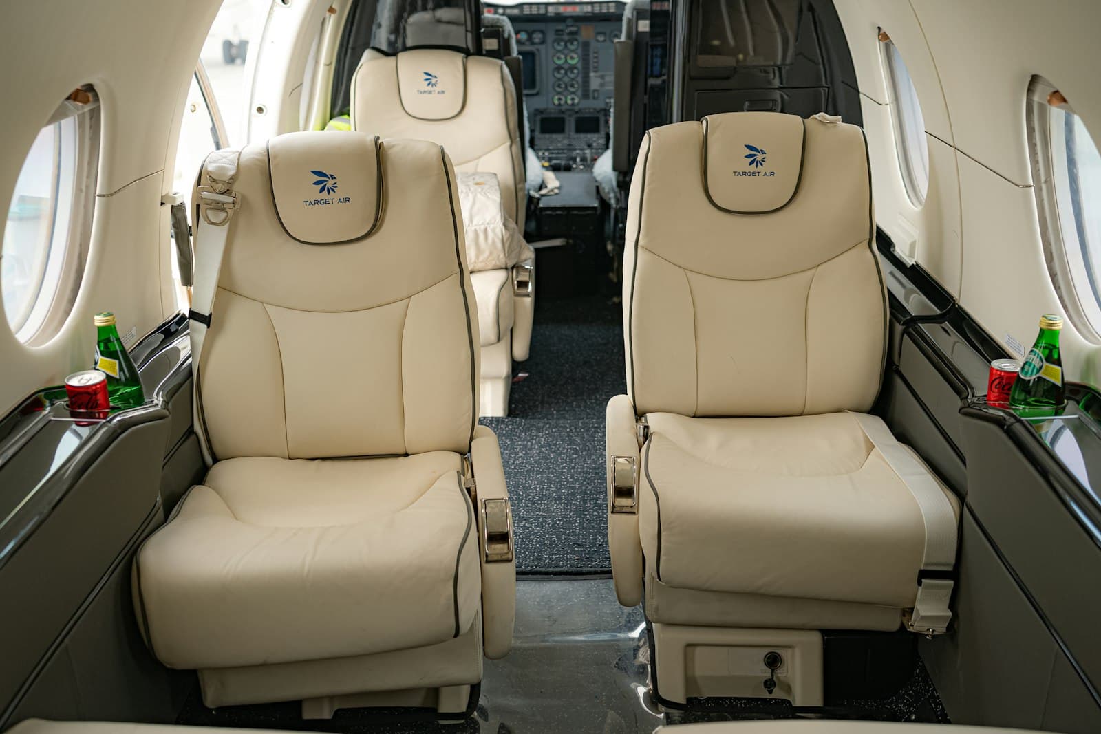 A wide cabin section seen end to end, premium seating throughout.