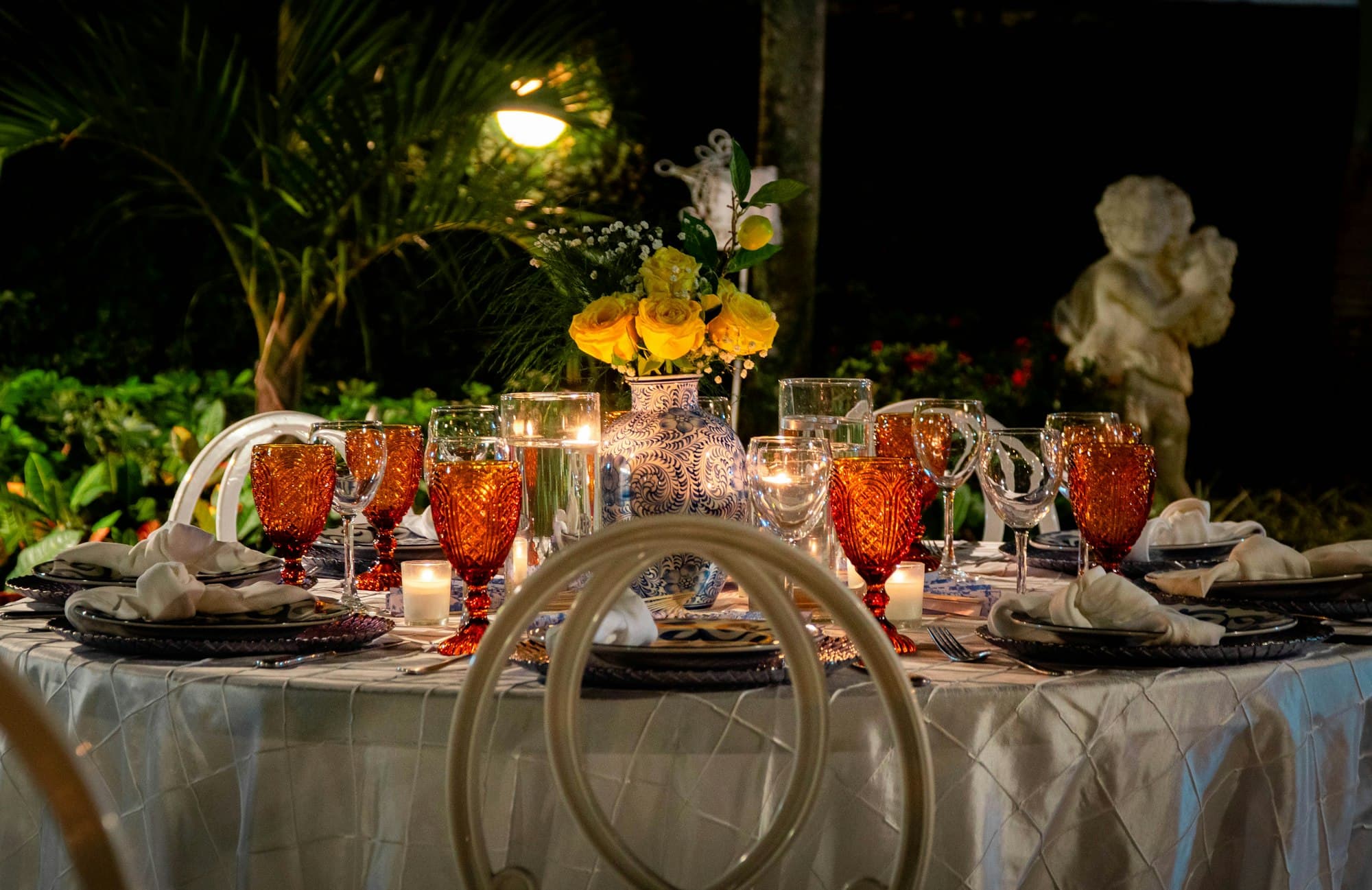 Wine being poured at a cabin window in soft candlelight, late afternoon outside.